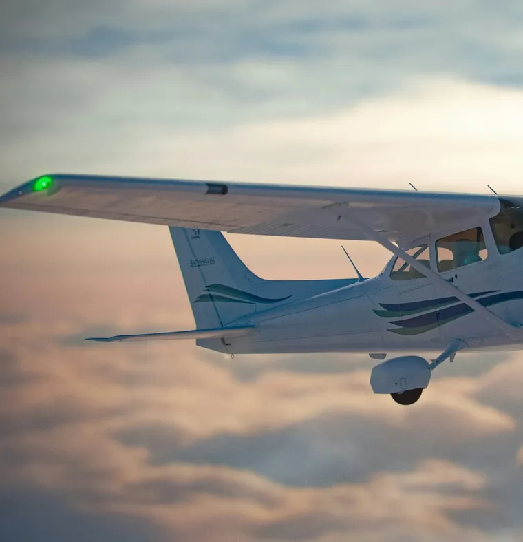 A single-engine Cessna in flight, representing FAA BasicMed exams at Fort Walton Beach Chiropractic